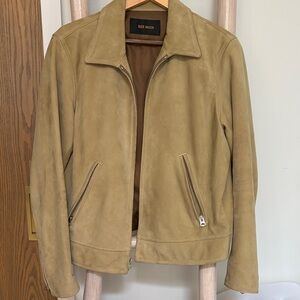 Buck Mason Black Label on Brown Fabric